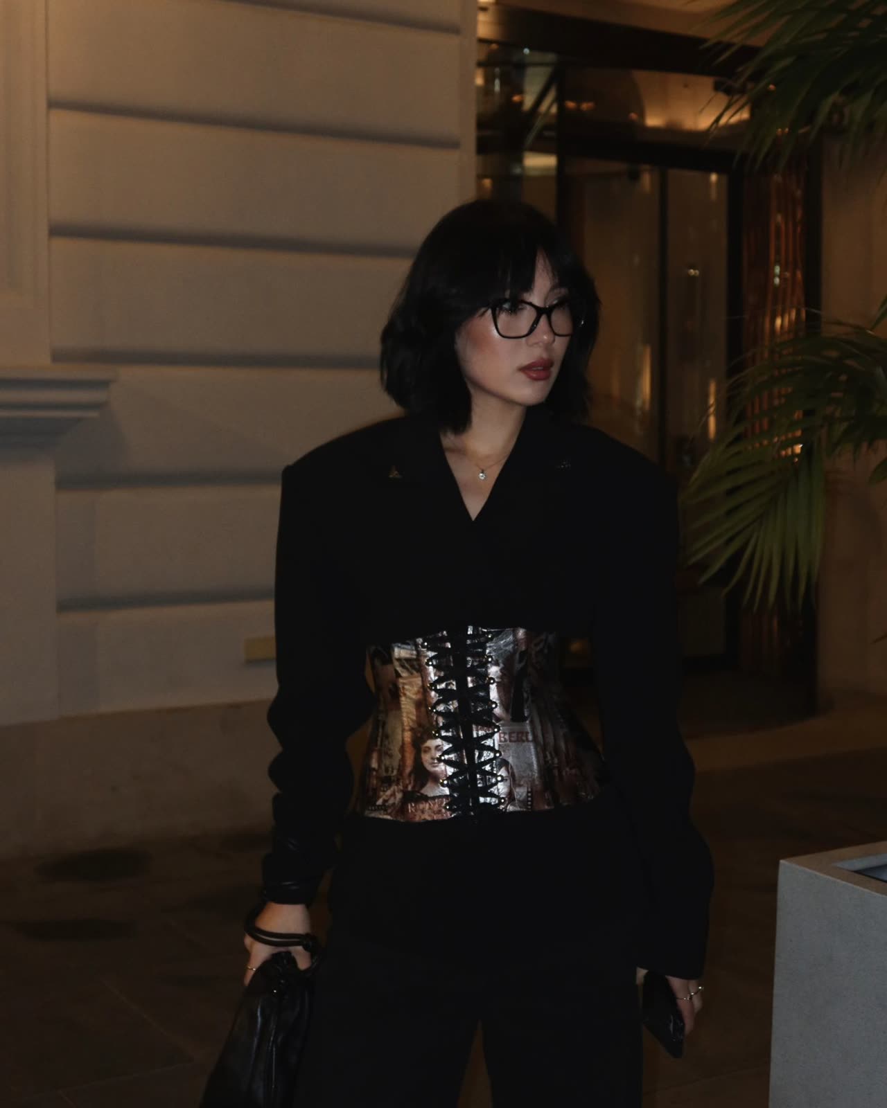 Model in a corset belt at night